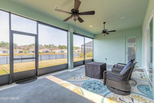 sunroom with ceiling fan