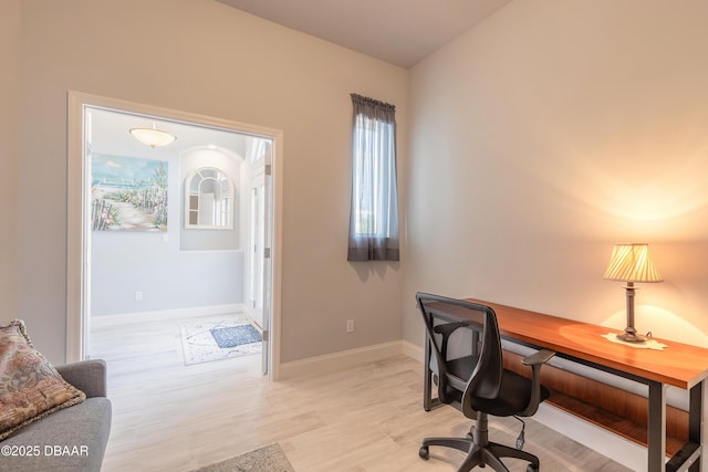 office space with light wood-type flooring