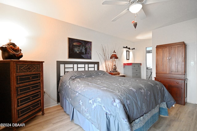 bedroom featuring ceiling fan and light hardwood / wood-style floors