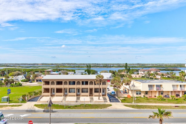 bird's eye view with a residential view and a water view