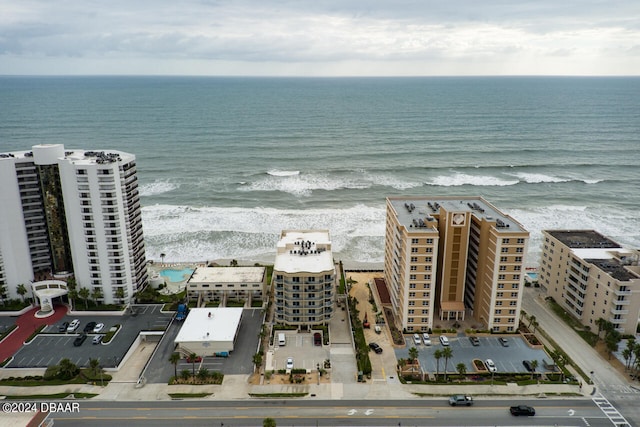 aerial view with a water view and a view of the beach
