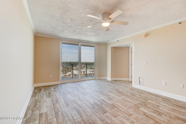 unfurnished room featuring ornamental molding, ceiling fan, light wood-style floors, and a textured ceiling