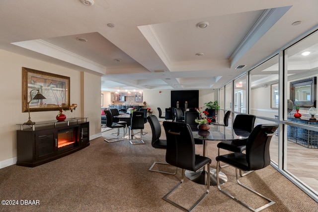 carpeted dining space featuring baseboards, ornamental molding, and a fireplace