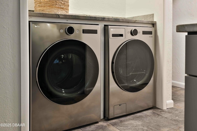 laundry room with separate washer and dryer