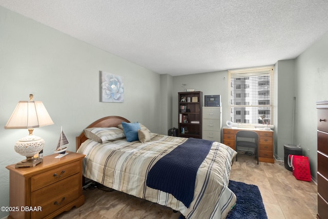 bedroom featuring a textured ceiling