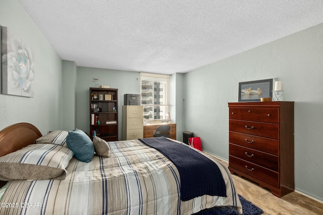 carpeted bedroom featuring a textured ceiling