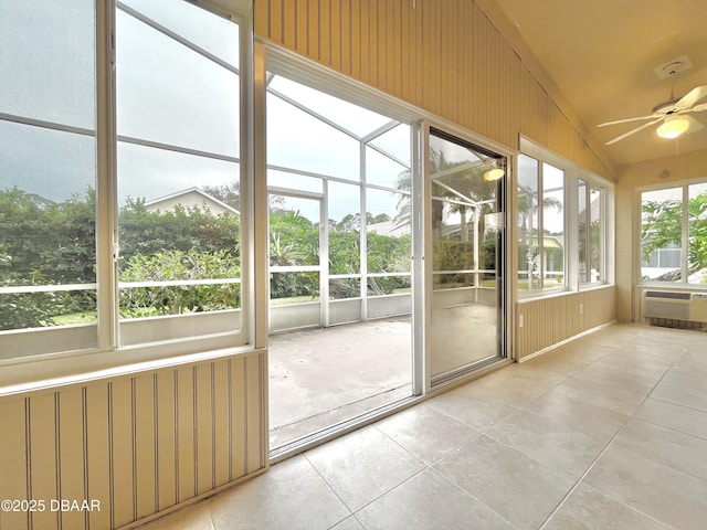 unfurnished sunroom featuring ceiling fan and lofted ceiling