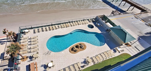 view of swimming pool with a water view