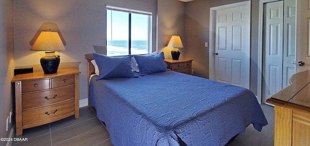 bedroom with dark hardwood / wood-style flooring