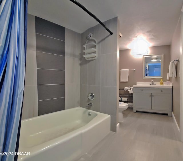 full bathroom featuring toilet, vanity, and shower / tub combo with curtain