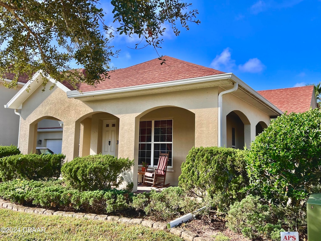 mediterranean / spanish-style house featuring covered porch