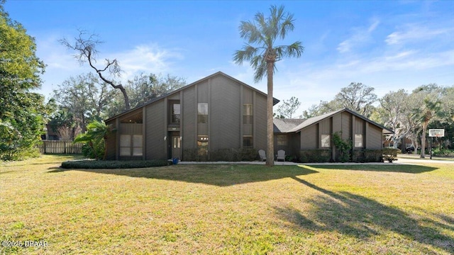 view of side of home featuring a lawn