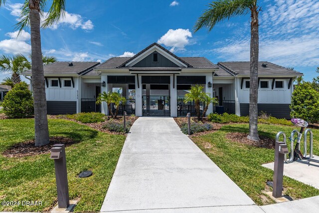 6232 W Fallsgrove Ln, Port Orange, FL 32128 - view of front facade featuring a front yard