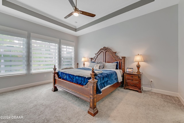 6232 W Fallsgrove Ln, Port Orange, FL 32128 - bedroom featuring ceiling fan, light carpet, and a tray ceiling