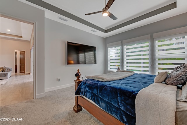 6232 W Fallsgrove Ln, Port Orange, FL 32128 - carpeted bedroom featuring ceiling fan and a tray ceiling