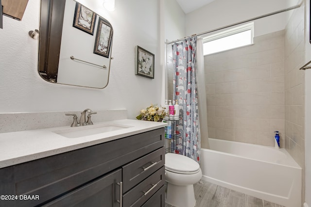 6232 W Fallsgrove Ln, Port Orange, FL 32128 - full bathroom with hardwood / wood-style floors, vanity, toilet, and shower / bathtub combination with curtain