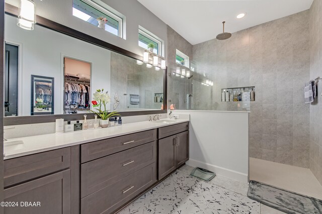 6232 W Fallsgrove Ln, Port Orange, FL 32128 - bathroom featuring vanity, tile patterned floors, and a tile shower