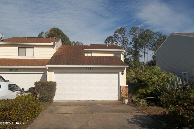 view of side of home featuring a garage and a yard