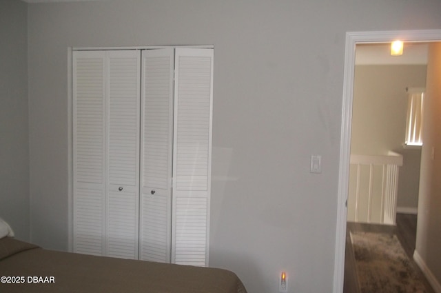 1101 Monticello Ln Unit 3, Port Orange, FL 32129 - bedroom featuring a closet and dark wood-style flooring