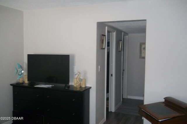 1101 Monticello Ln Unit 3, Port Orange, FL 32129 - bedroom with dark wood-type flooring and baseboards