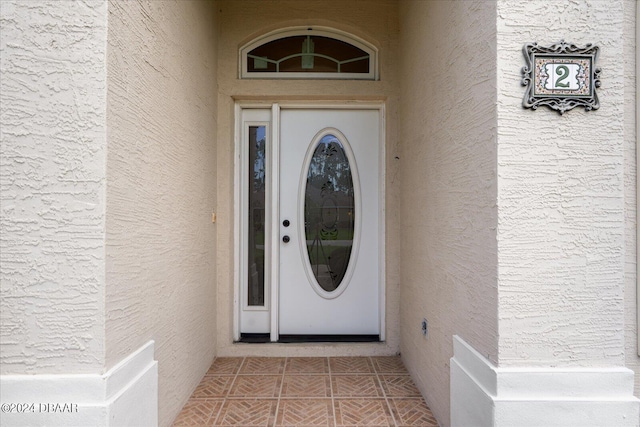 2 Elliot Pl, Palm Coast, FL 32164 - view of exterior entry featuring stucco siding