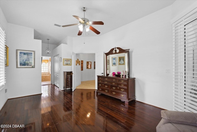 interior space with ceiling fan and dark hardwood / wood-style floors