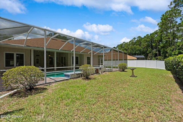 2 Elliot Pl, Palm Coast, FL 32164 - back of property with glass enclosure and a shingled roof
