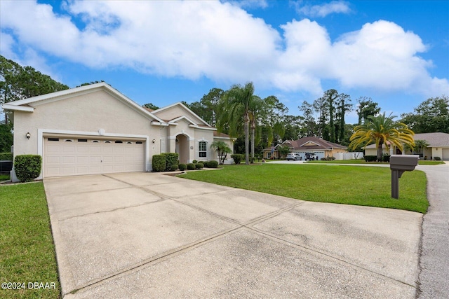 view of front facade with a front lawn and a garage