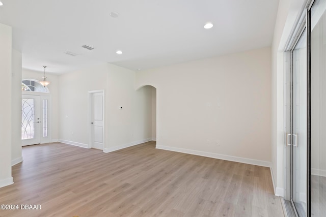 spare room featuring light hardwood / wood-style floors