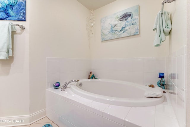 bathroom with tile patterned flooring and tiled tub