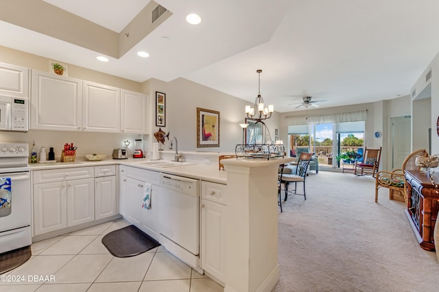 kitchen with white cabinetry, light carpet, kitchen peninsula, and white appliances