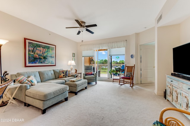 living room featuring light colored carpet and ceiling fan