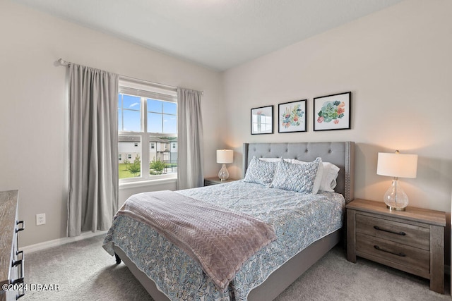 bedroom featuring light colored carpet