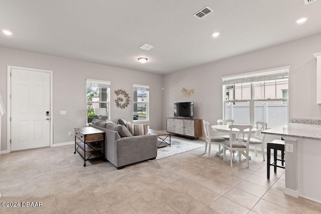 living room with light tile patterned flooring