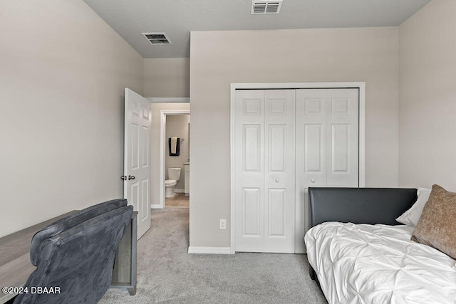 carpeted bedroom featuring a closet