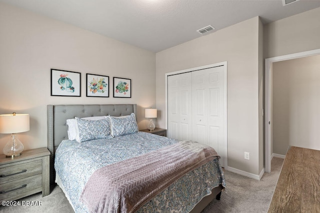 carpeted bedroom with a closet