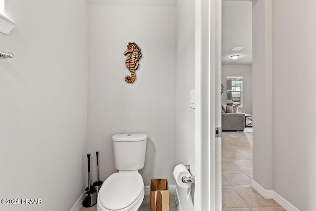 bathroom featuring toilet and tile patterned floors