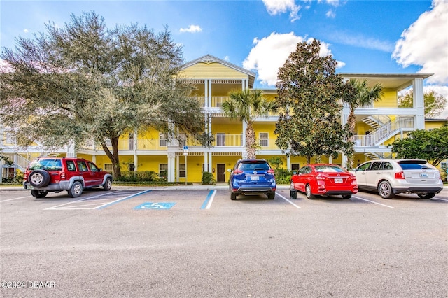 707 Gran Bahama Blvd, Davenport, FL 33897 - view of building exterior featuring uncovered parking and stairway