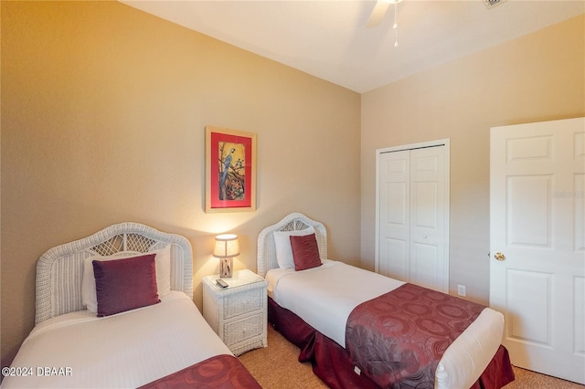 carpeted bedroom with a closet and ceiling fan