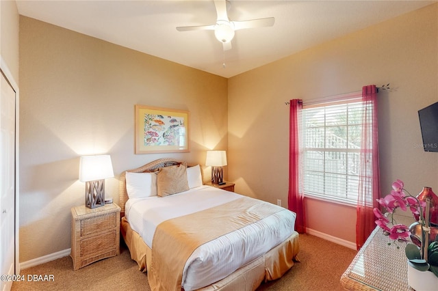 bedroom featuring light colored carpet and ceiling fan