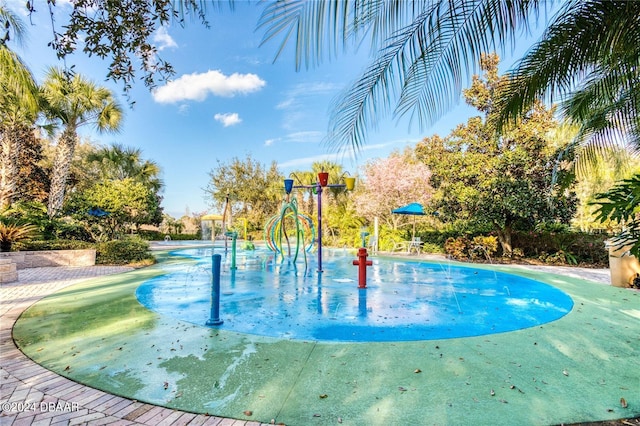 view of pool featuring a playground