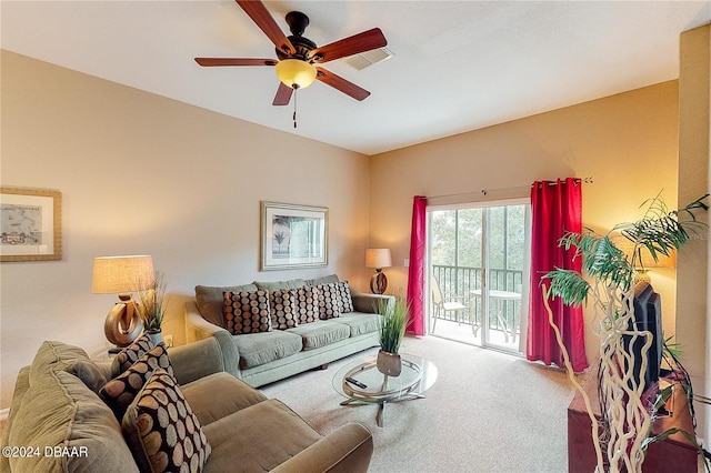 carpeted living room featuring ceiling fan