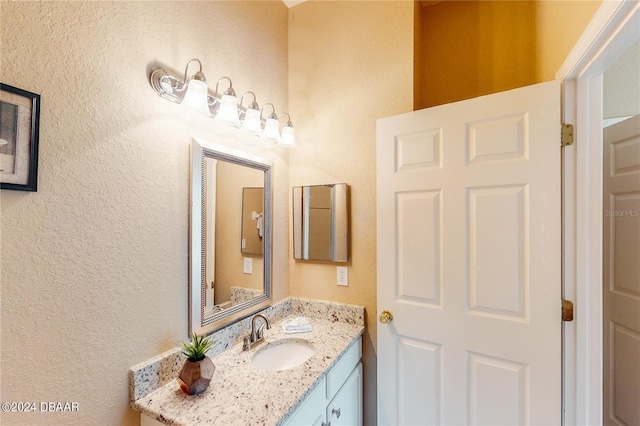 707 Gran Bahama Blvd, Davenport, FL 33897 - bathroom featuring a textured wall and vanity