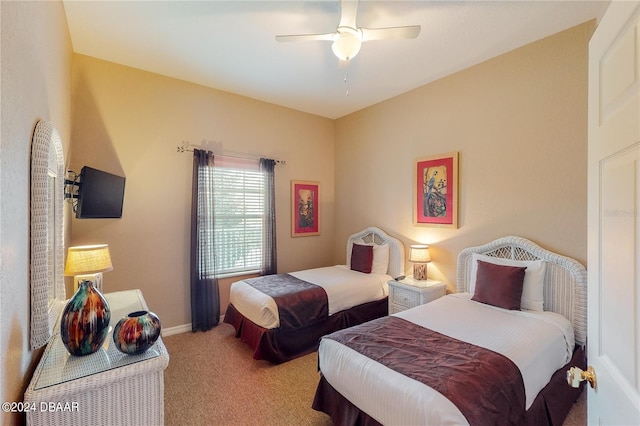 bedroom with light colored carpet and ceiling fan