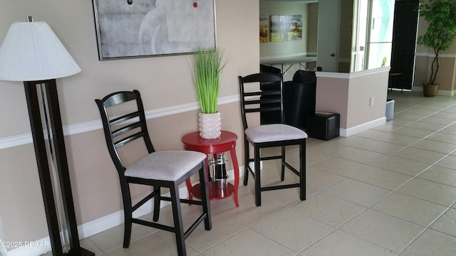 living area featuring light tile patterned floors