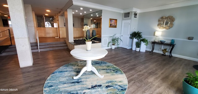 interior space with dark wood-type flooring and ornamental molding