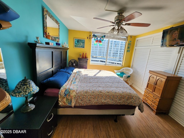 bedroom featuring ceiling fan and hardwood / wood-style flooring