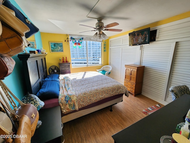 bedroom with hardwood / wood-style floors and ceiling fan