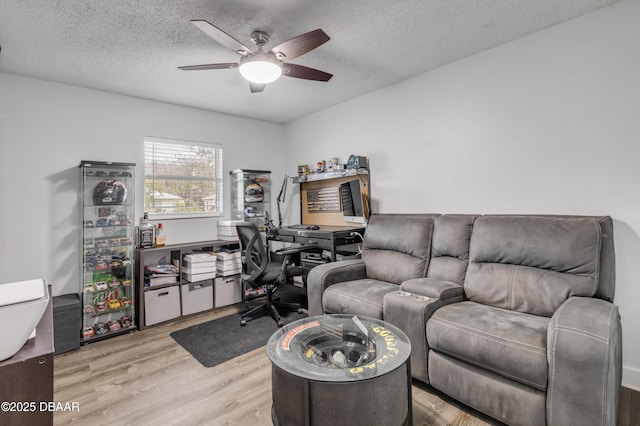 office with ceiling fan, a textured ceiling, and light hardwood / wood-style floors