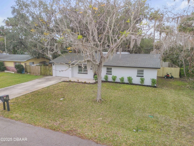 view of front of house featuring a garage and a front lawn